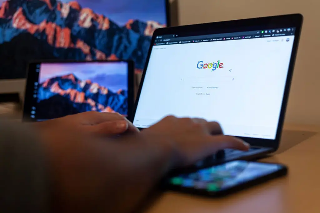 Person using Google on a laptop